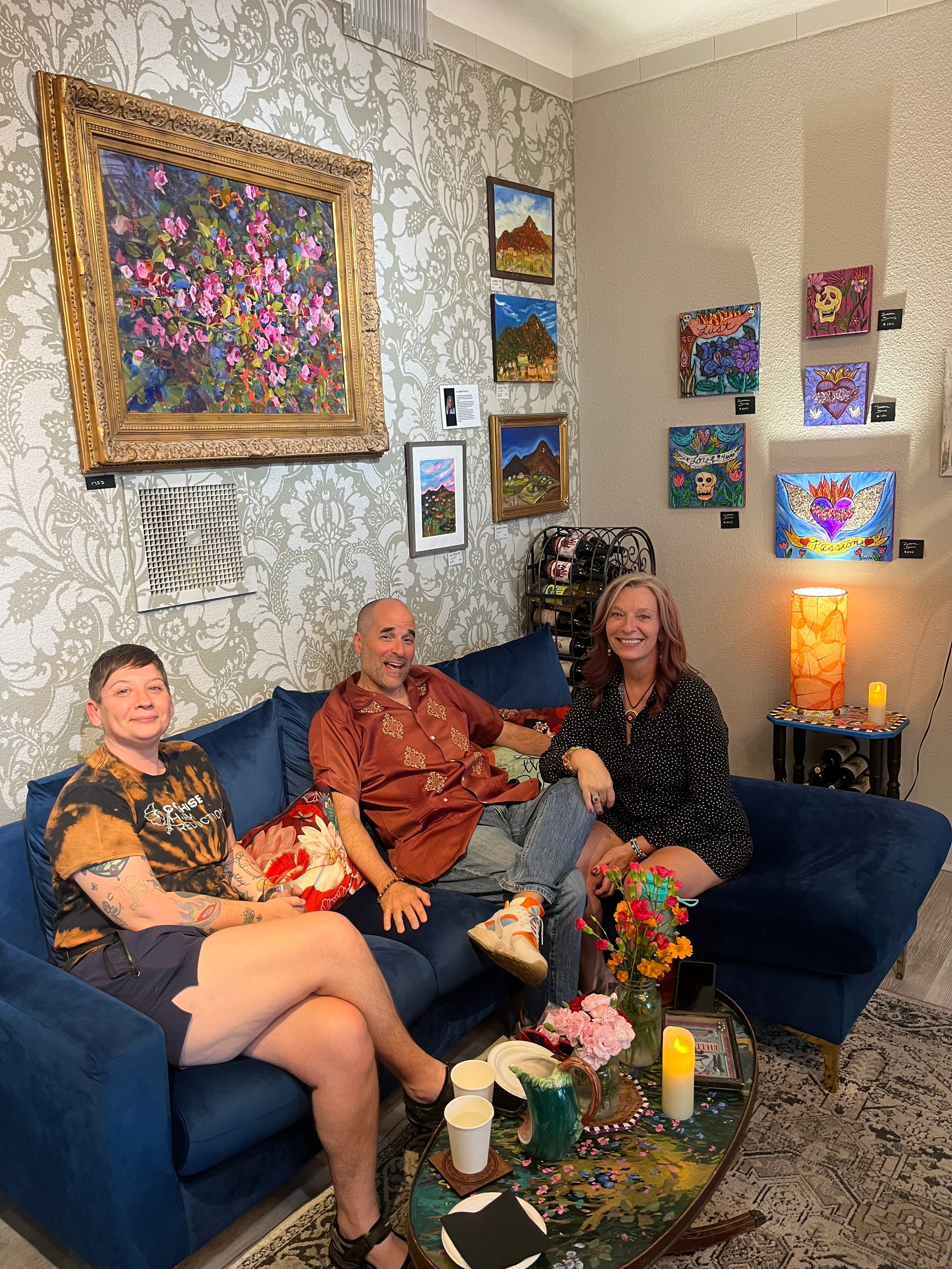 Guests with artwork at Vino Zona tasting room