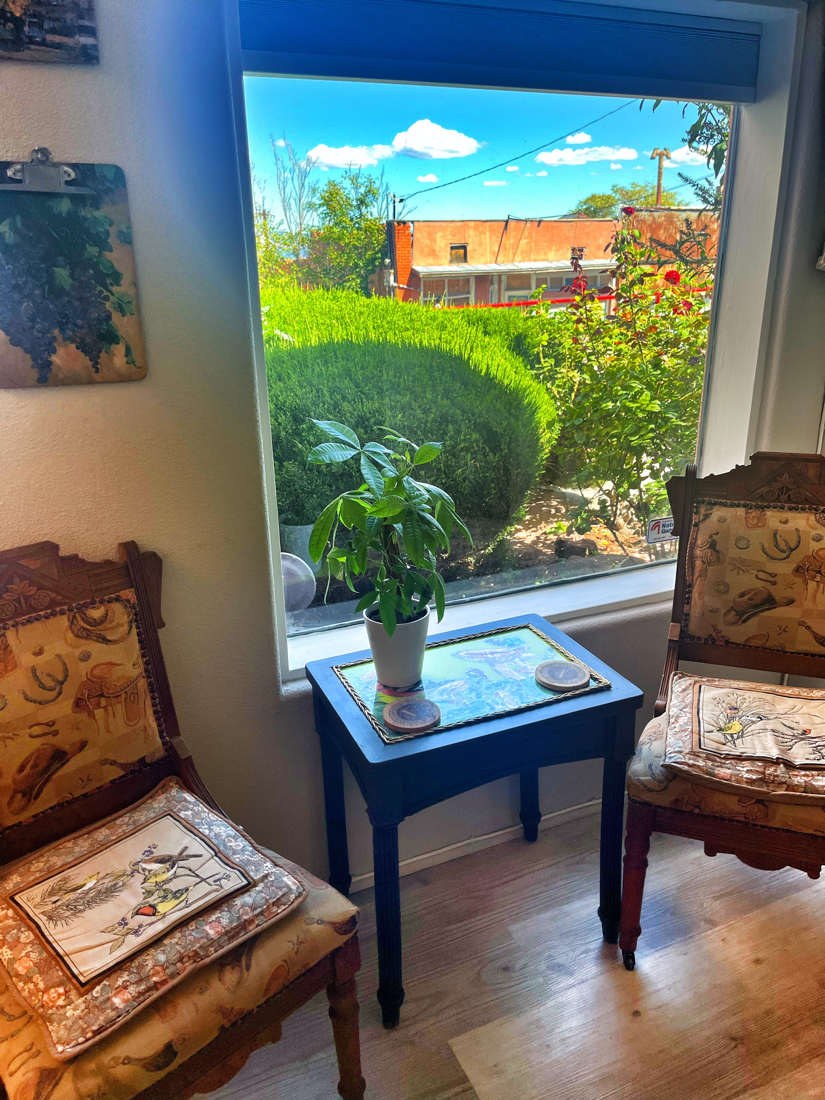Cozy window nook with vintage chairs at Vino Zona