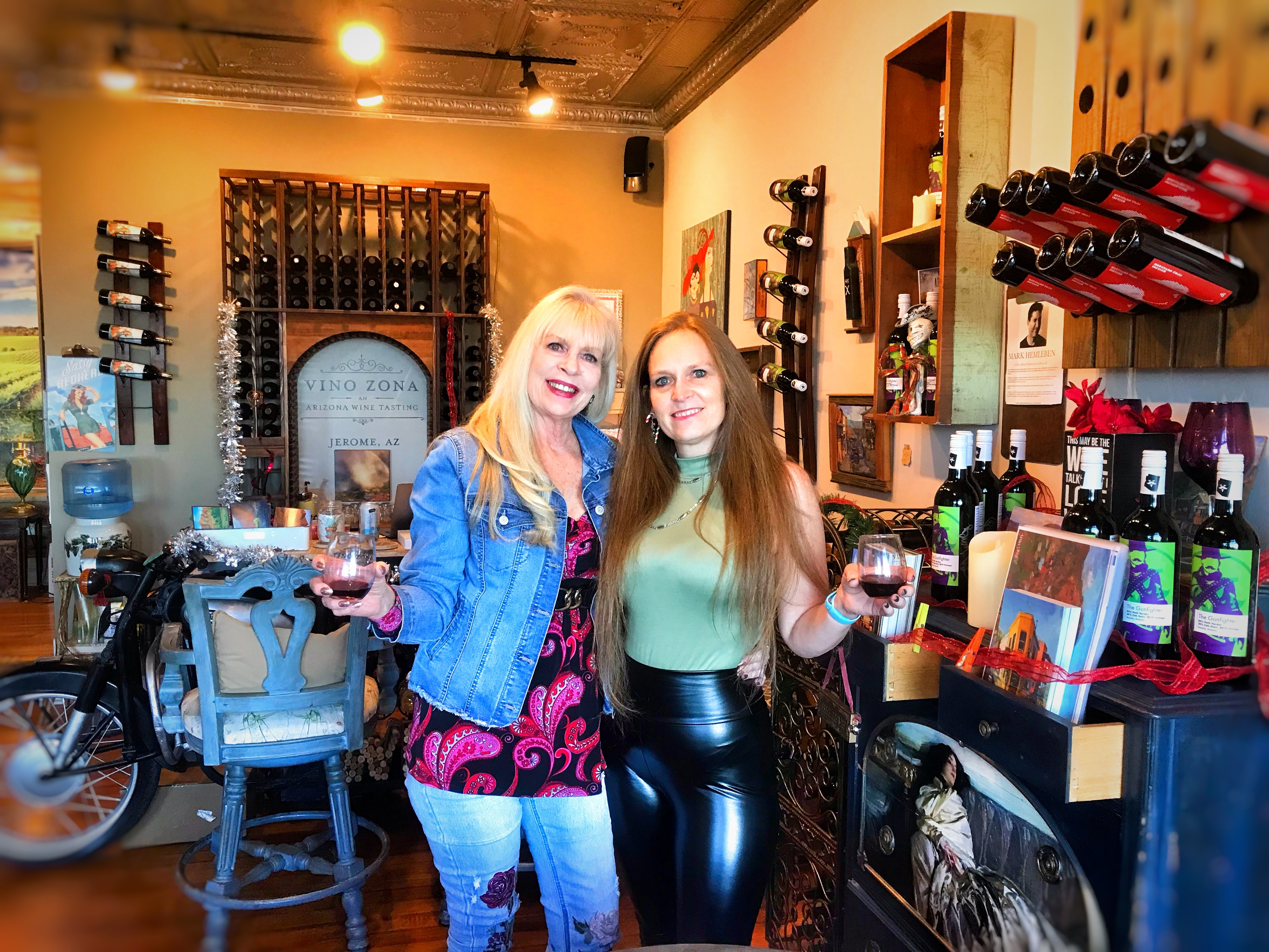 Two women toasting wine at Vino Zona Jerome