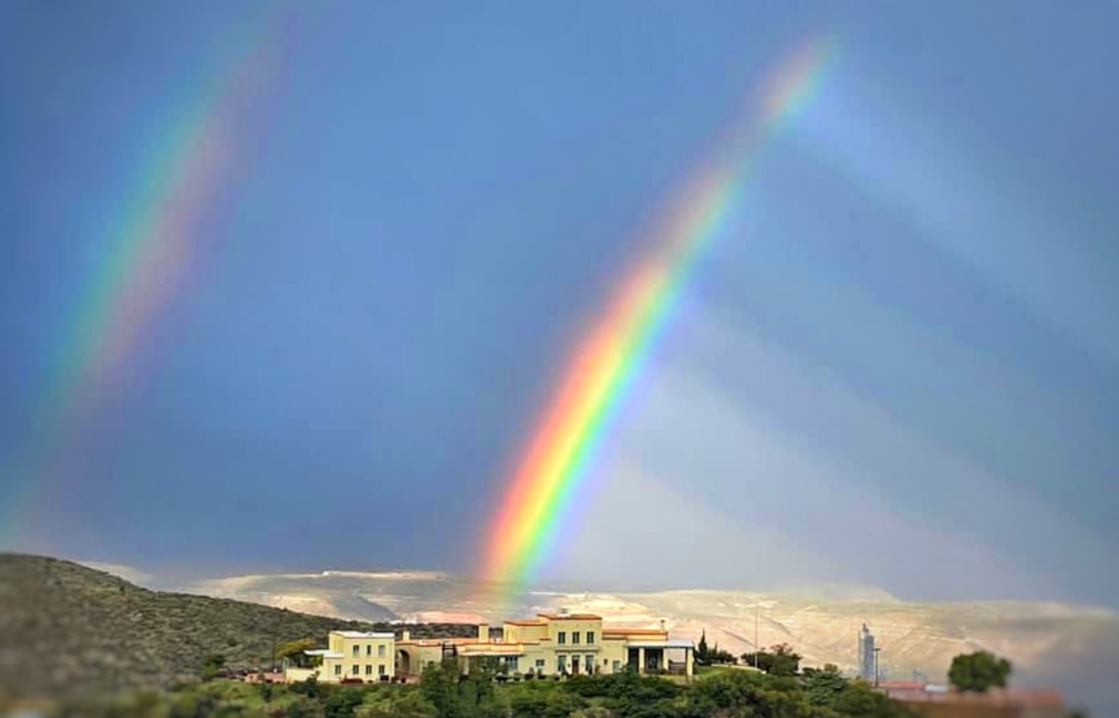 Double rainbow over Jerome Arizona hillside
